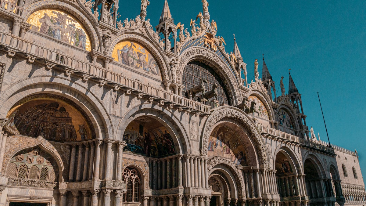 Golden mosaic detail inside St. Mark's Basilica showing Byzantine figures