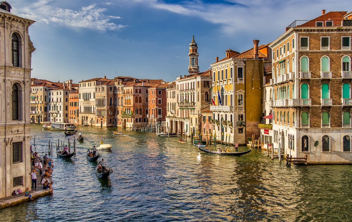 Alilaguna water bus crossing the Venice lagoon with the city skyline in the distance